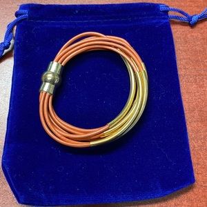 Handcrafted leather bracelet with gold curved tube beads and magnetic clasp